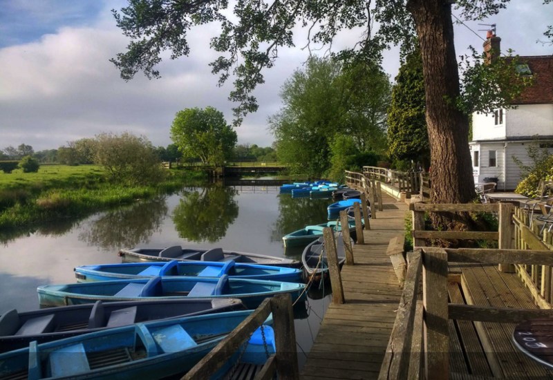 The Anchor Inn, East Sussex, by the river with blue canoes
